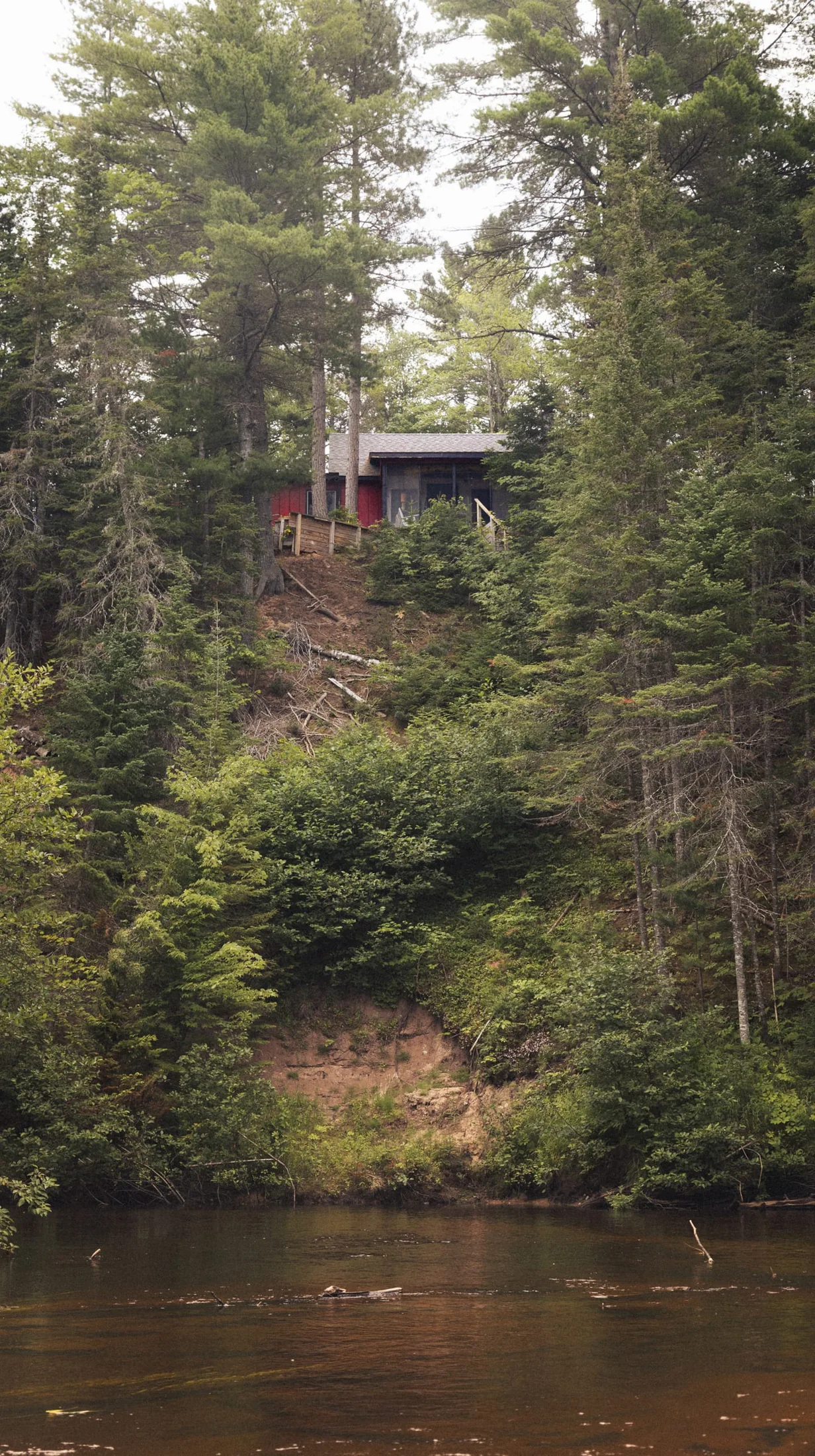 Camp Two Hearted cabin sitting above the Two Hearted River
